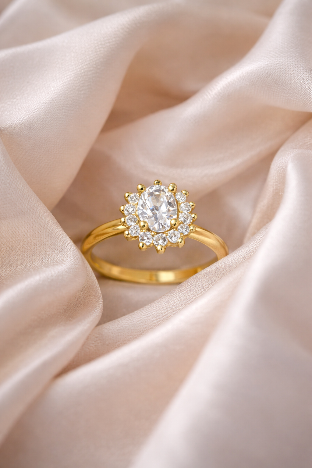 Elegant Oval Halo Diamond Ring on Blush Silk Background