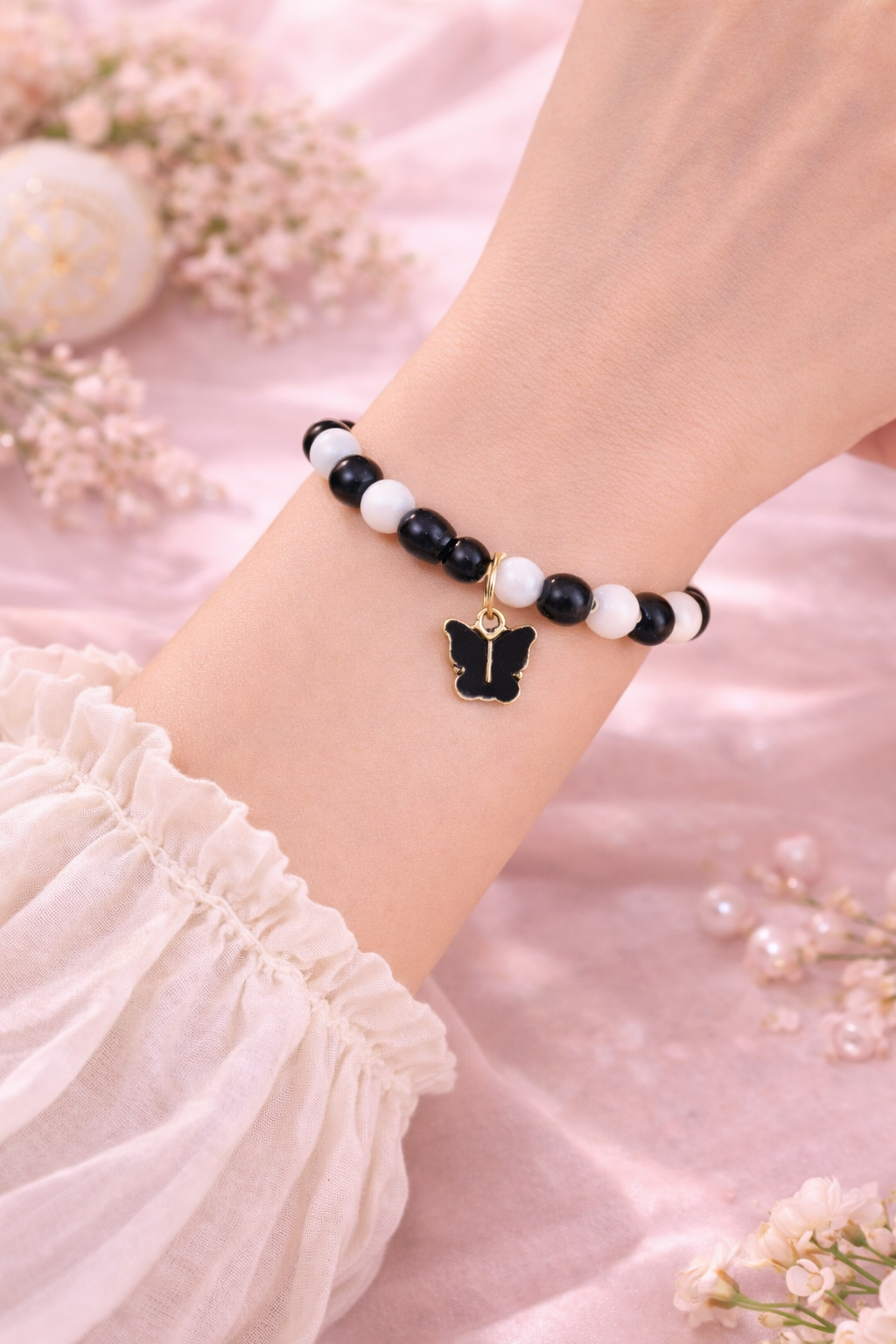 Black & White Beaded Bracelet with Butterfly Charm