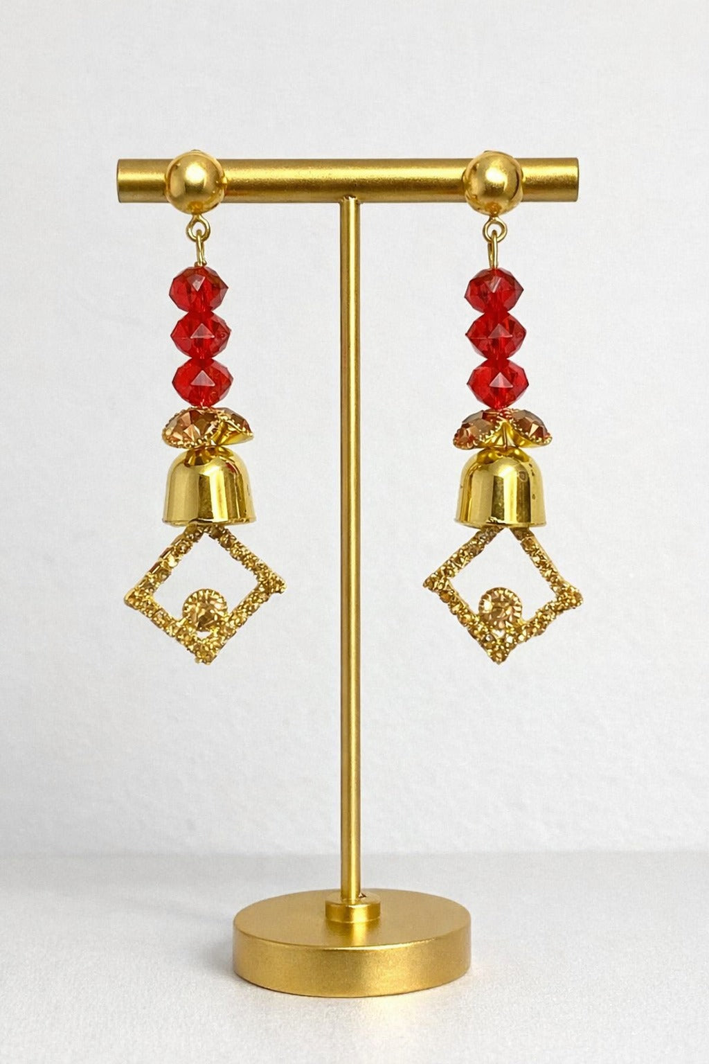 Golden Geometric Drop Earrings with Red Crystal Beads