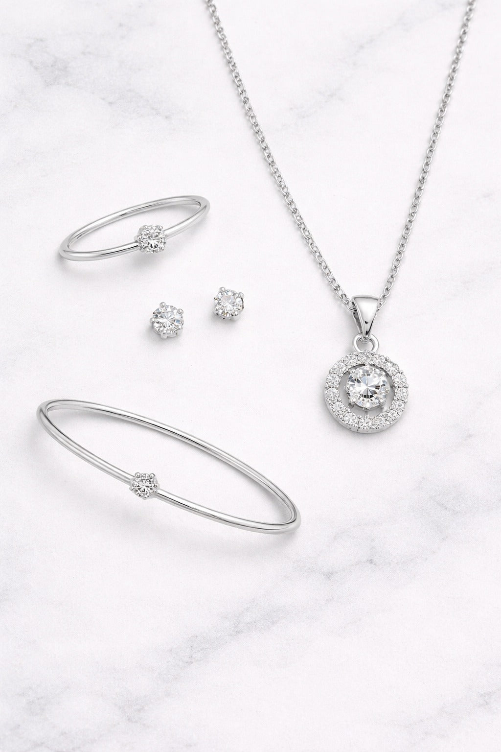 Elegant Silver-Tone CZ Jewelry Set – Pendant Necklace, Bracelet, Ring & Stud Earrings
