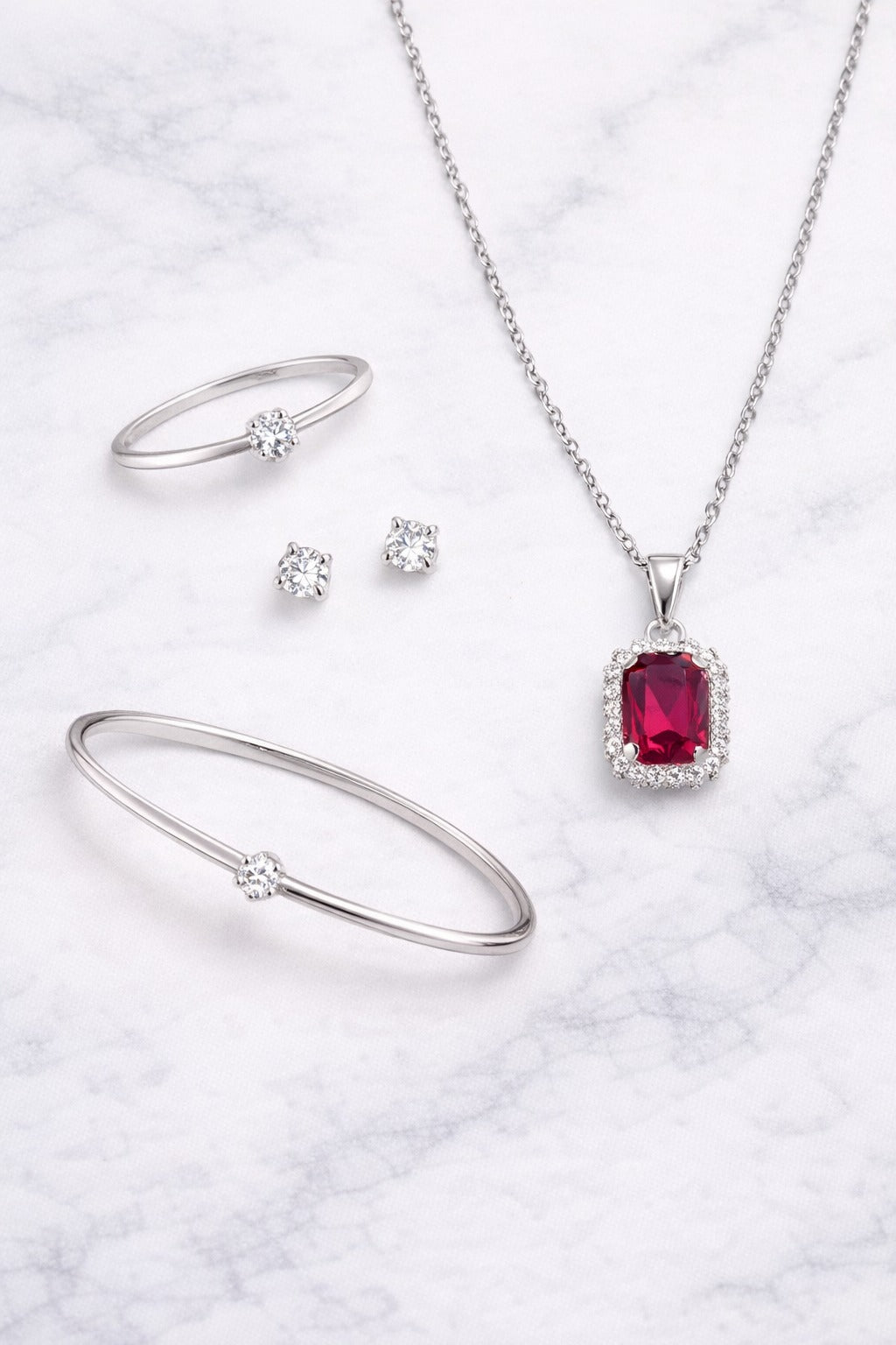 Elegant Ruby Red Stone Silver-Tone Jewelry Set – Pendant Necklace, Bracelet, Ring & Stud Earrings