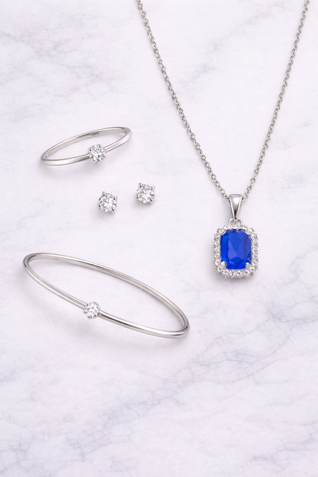 Elegant Sapphire Blue Stone Silver-Tone Jewelry Set – Pendant Necklace, Bracelet, Ring & Stud Earrings
