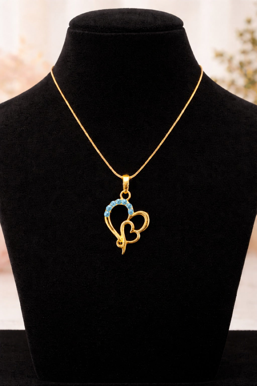Elegant Gold Heart Pendant Necklace with Blue Gem Accents on Delicate Chain